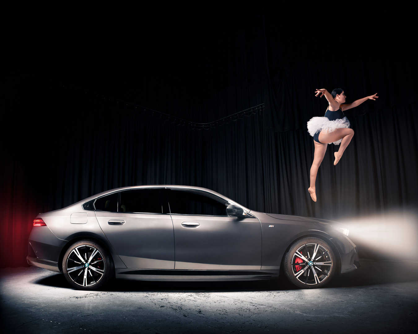 Dancer leaping off the BMW i5.