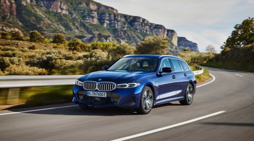 BMW 330e Touring driving on windy road.